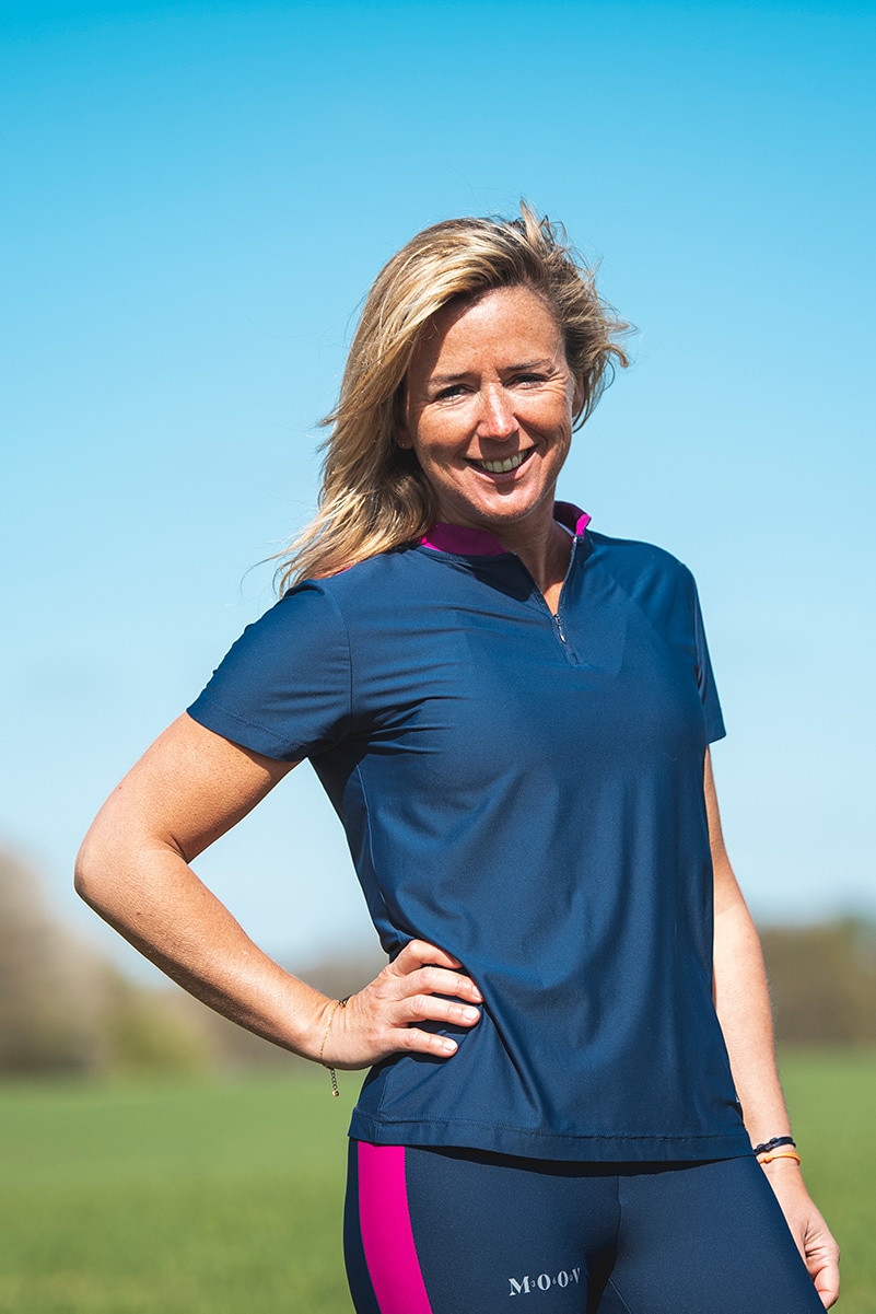 Woman smiling wearing sustainable sportswear by Moov360