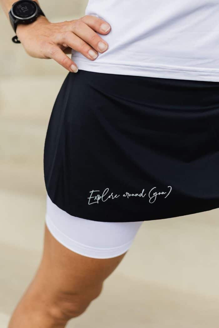 Explore around you tagline printed on sport skirt